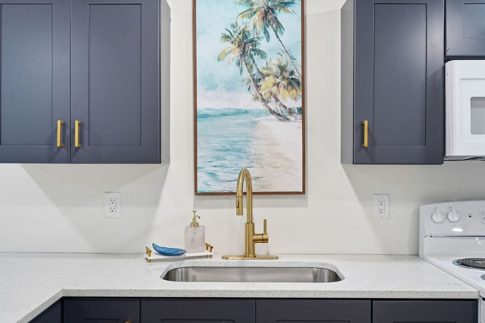 The kitchen is centrally located in the home, offering clear sightlines to the living and dining areas so you can stay connected while cooking. It features ample cabinet space, an oven, refrigerator, microwave, and sink, and is fully equipped with everyth