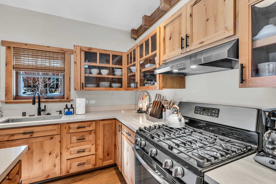 Kitchen: New appliances, kettle, coffee maker and white counter top