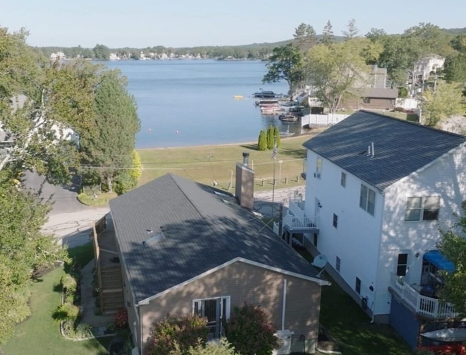 Directly across the quiet street from the semi-private beach and boat launch