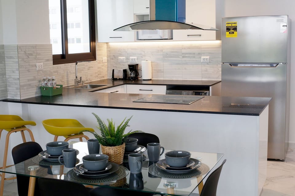 Exclusive Apartment | Private kitchen | Full-size fridge, microwave, cookware/dishes/utensils, paper towels