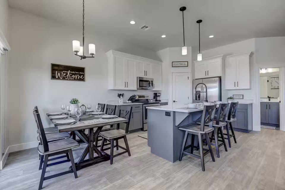 Cook, dine, and unwind all in one place—this well-equipped kitchen flows effortlessly into the dining area and opens to the outdoor patio for seamless indoor-outdoor living.