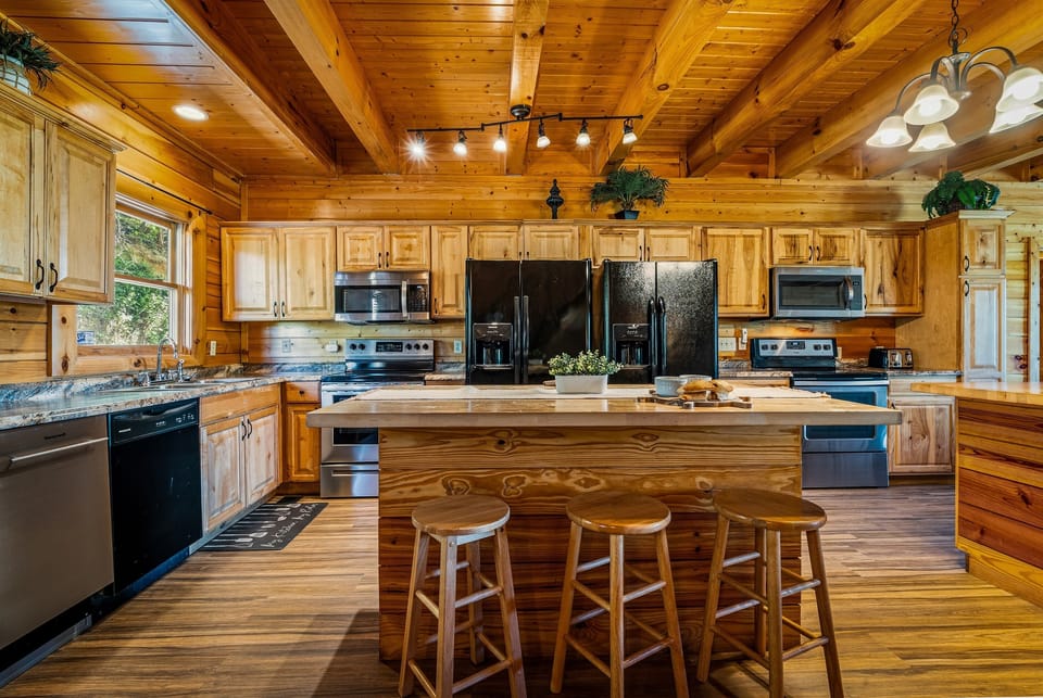 Spacious, fully equipped kitchen with modern appliances and a large island—perfect for cooking and preparing meals for the whole group.