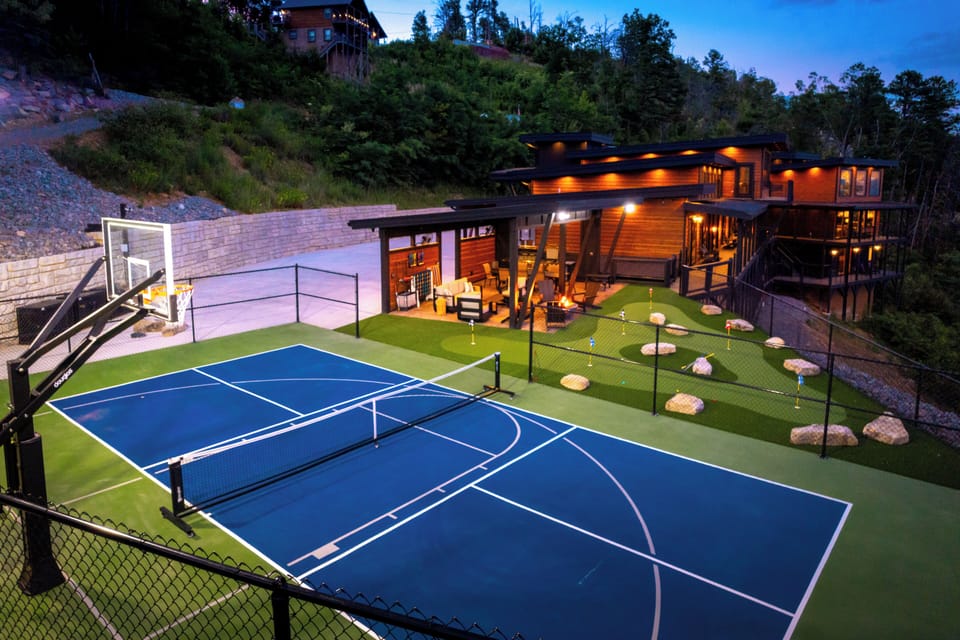 Outdoor recreation area with court, putt putt, pavilion, firepit, dining & grill