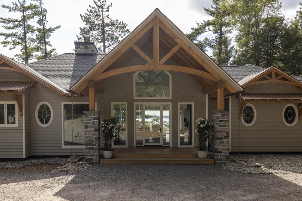 Charming cabin entrance with rustic timber accents and cozy appeal