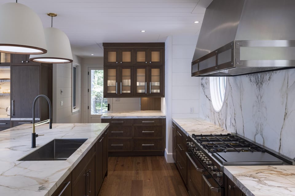 Sleek modern kitchen with marble countertops and ample storage