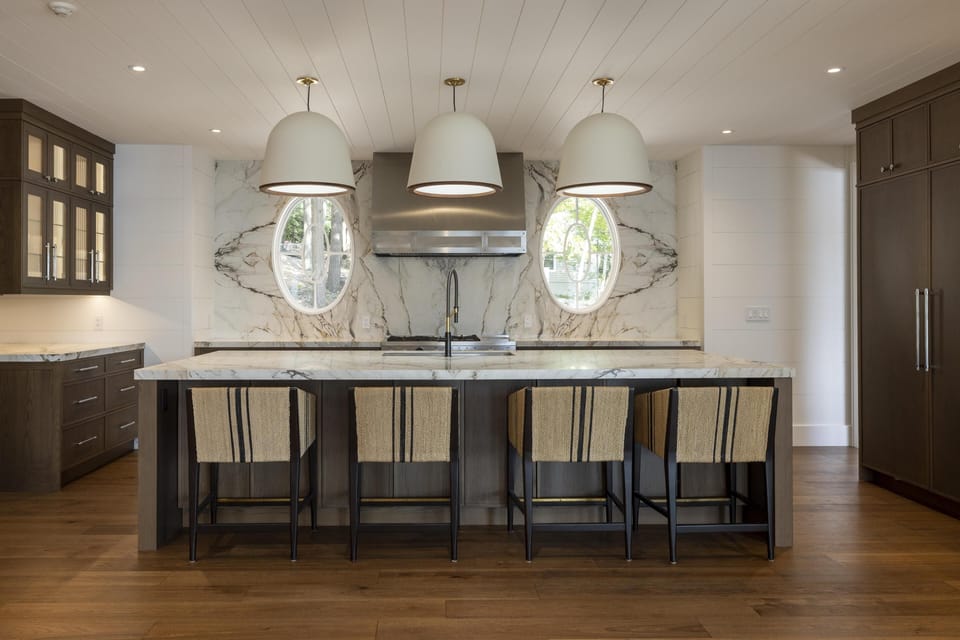 Spacious kitchen with marble island and cozy seating for gatherings