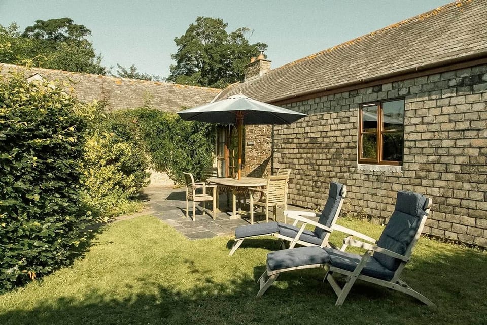 Enjoy alfresco dining in the private garden with outdoor furniture and BBQ