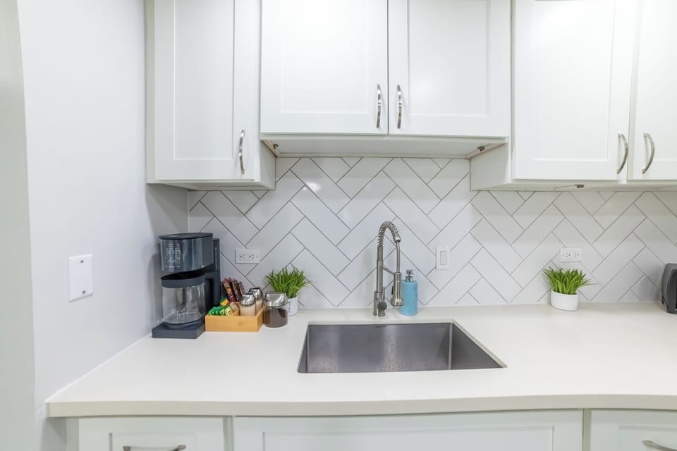 Large kitchen sink. Large coffee maker with fresh Starbucks coffee beans
