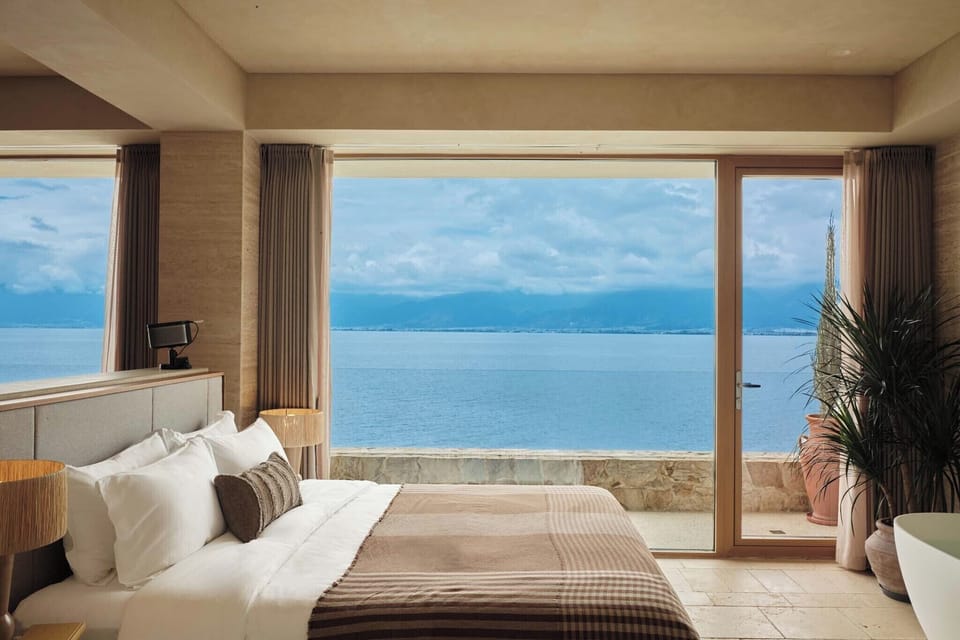Classic Double Room, Patio, Sea View | Minibar (free items), desk, laptop workspace, blackout drapes