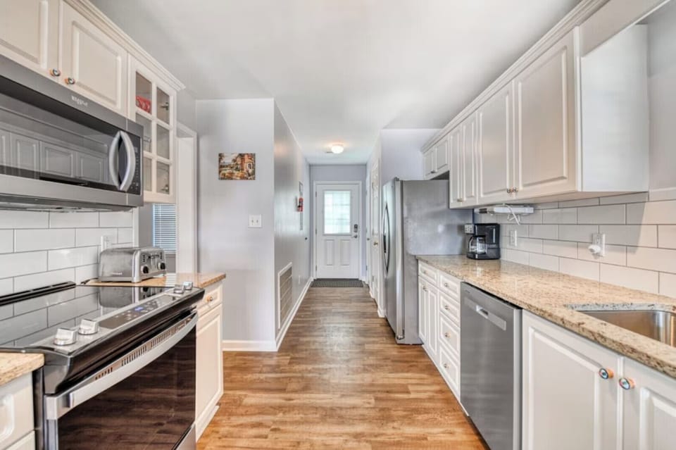 Spacious full kitchen with modern appliances for easy meal preparation.