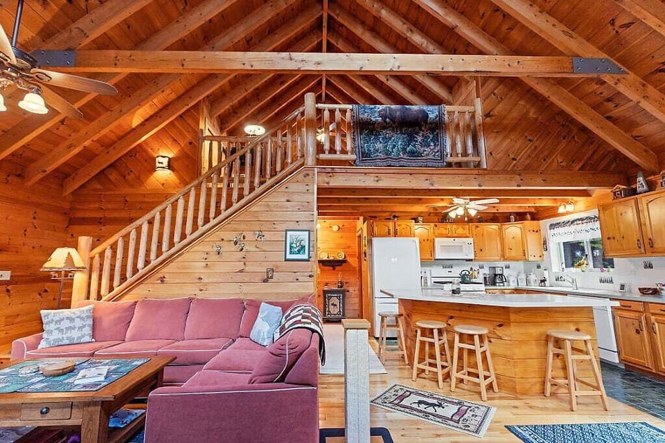 Living area and kitchen with loft above