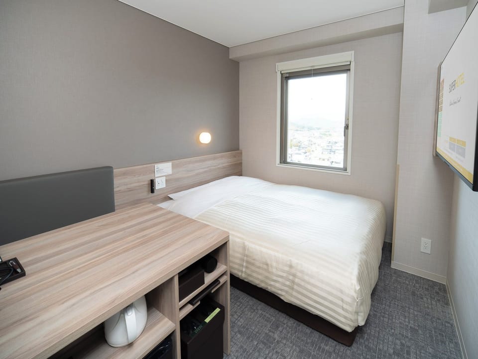 Desk, laptop workspace, blackout drapes, iron/ironing board