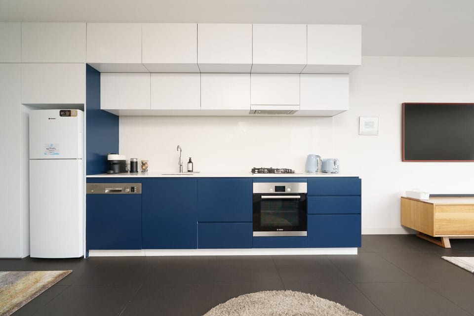 Create gourmet meals in a sleek, minimalist kitchen designed for the modern traveler, then dine with a view of the city skyline.