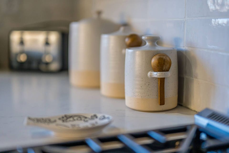 Handcrafted ceramic canisters and thoughtful kitchen details curated for a comfortable Park City vacation home.