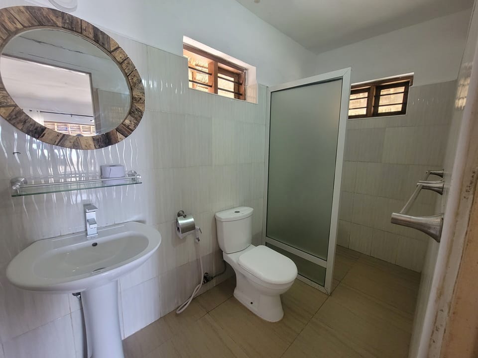 Deluxe Double Room, Patio, Beach View | Bathroom | Shower, free toiletries, bidet, towels