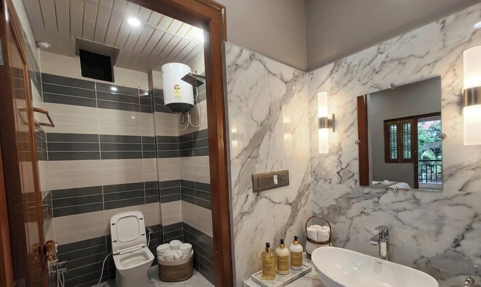 Shower, rainfall showerhead, towels, soap