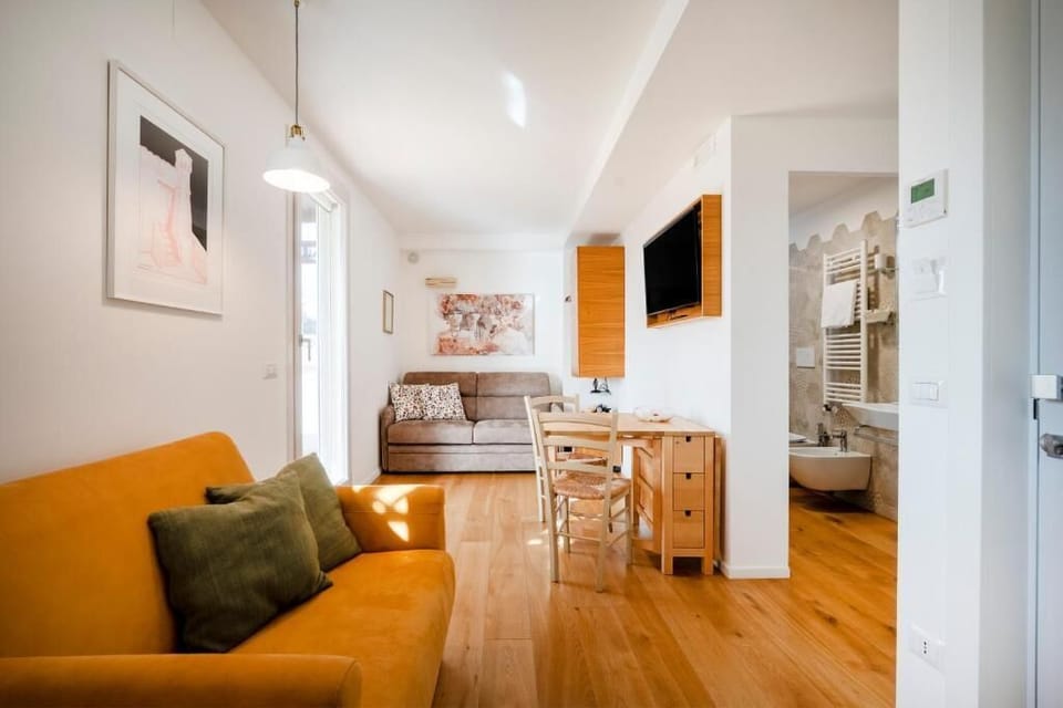 Family Suite, City View | Living area | Flat-screen TV