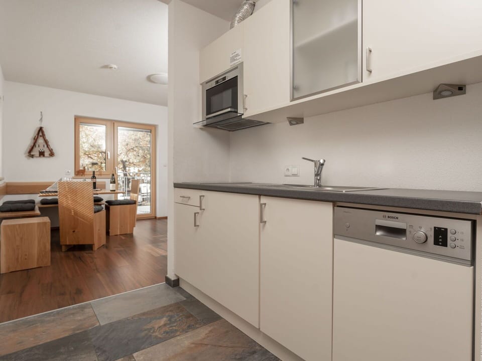 Interior Design, Flooring, Countertop, Wood, Floor, Kitchen, Cabinetry, Room, Furniture, Ceiling