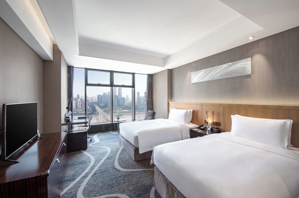 Deluxe Twin Room, River View | In-room safe, desk, laptop workspace, blackout drapes