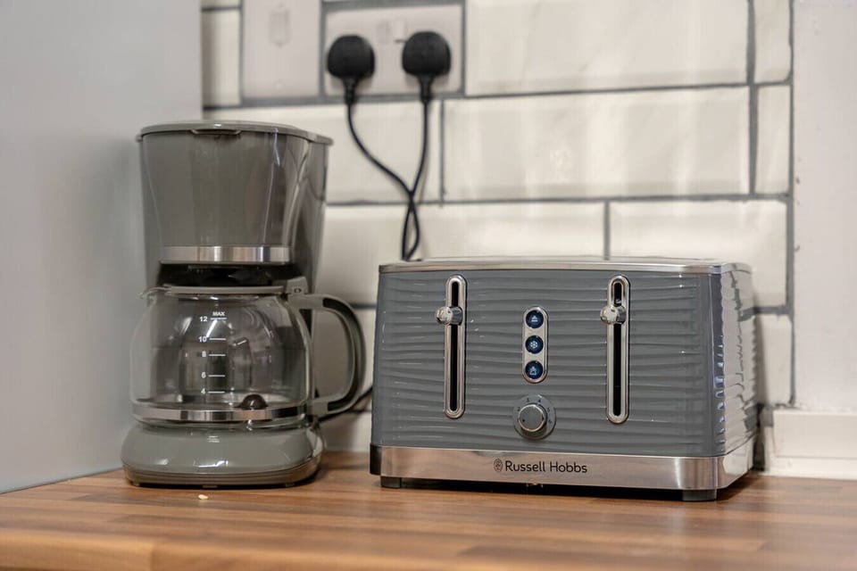 Kitchen counter detail with a coffee machine and toaster.