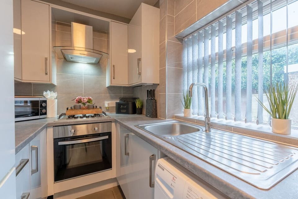 Cook and prep comfortably in the bright kitchen with plenty of worktop space.
