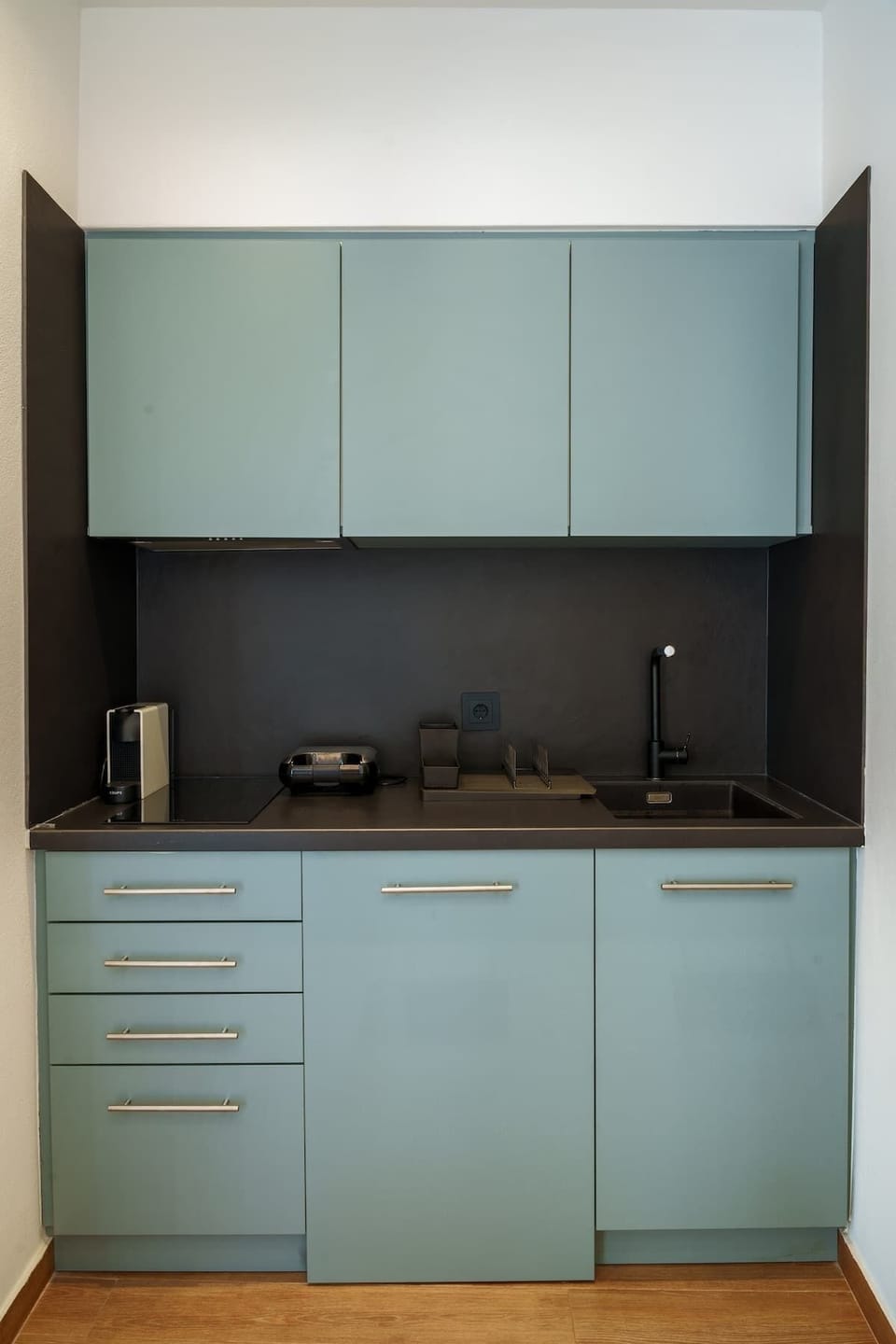 Open-Plan Kitchenette with Modern Cabinets