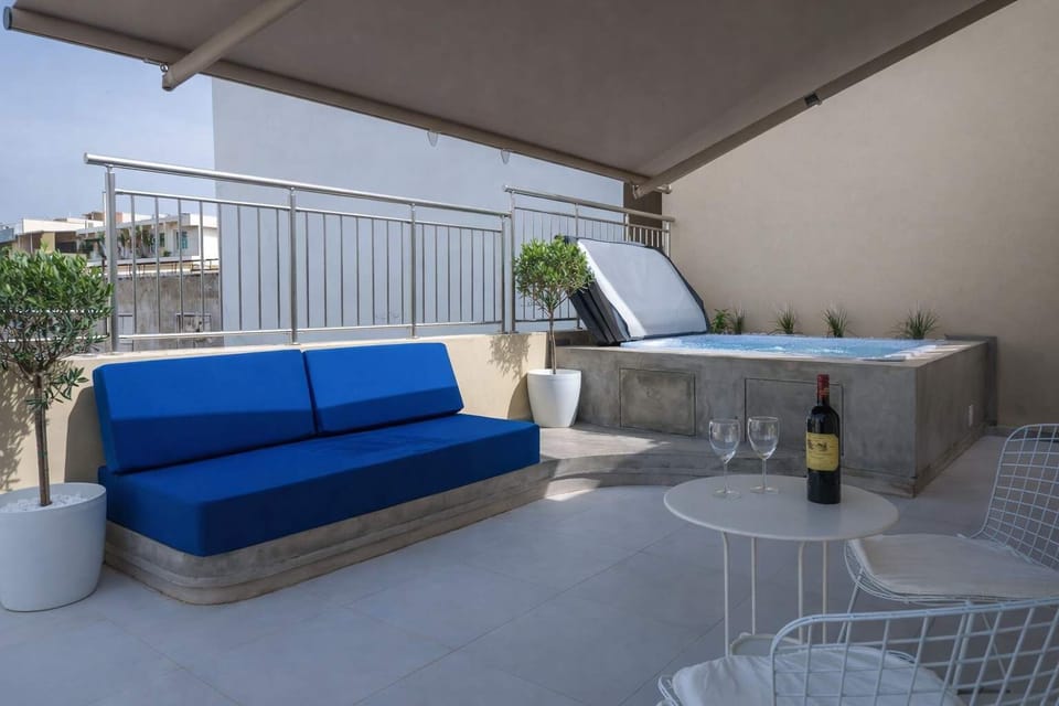 Spacious Private Terrace with Outdoor Sofa and Dining Area