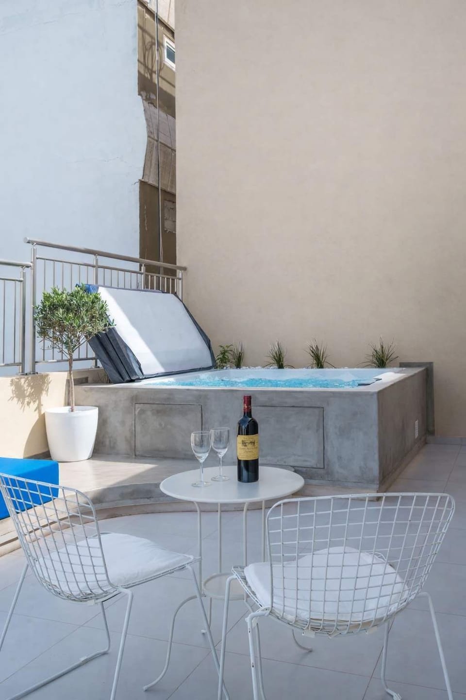 Outdoor Dining Table with Wine Setup on Private Terrace