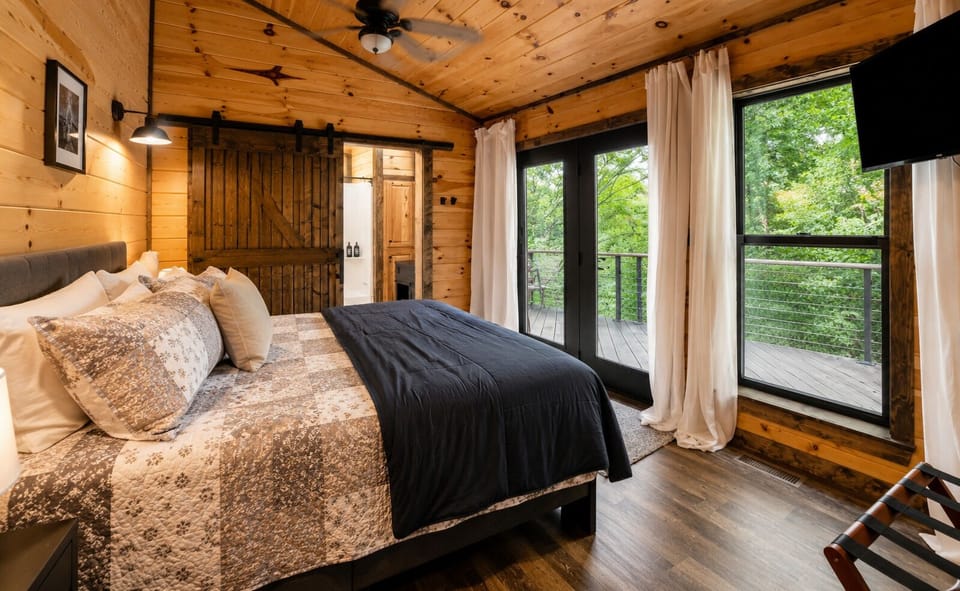 Mountain Modern bedroom with a plush king bed and direct deck access. 