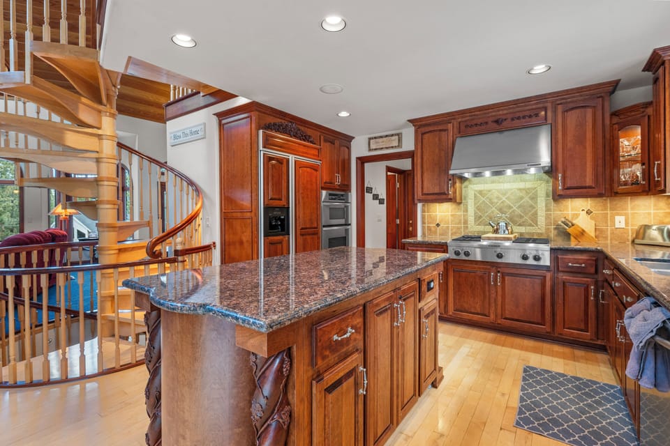 Full Kitchen - Cook with ease in a fully equipped gourmet kitchen featuring high-end appliances and a curated coffee and tea station. Ample counter space and quality cookware make preparing delicious home-cooked meals effortlessly enjoyable.