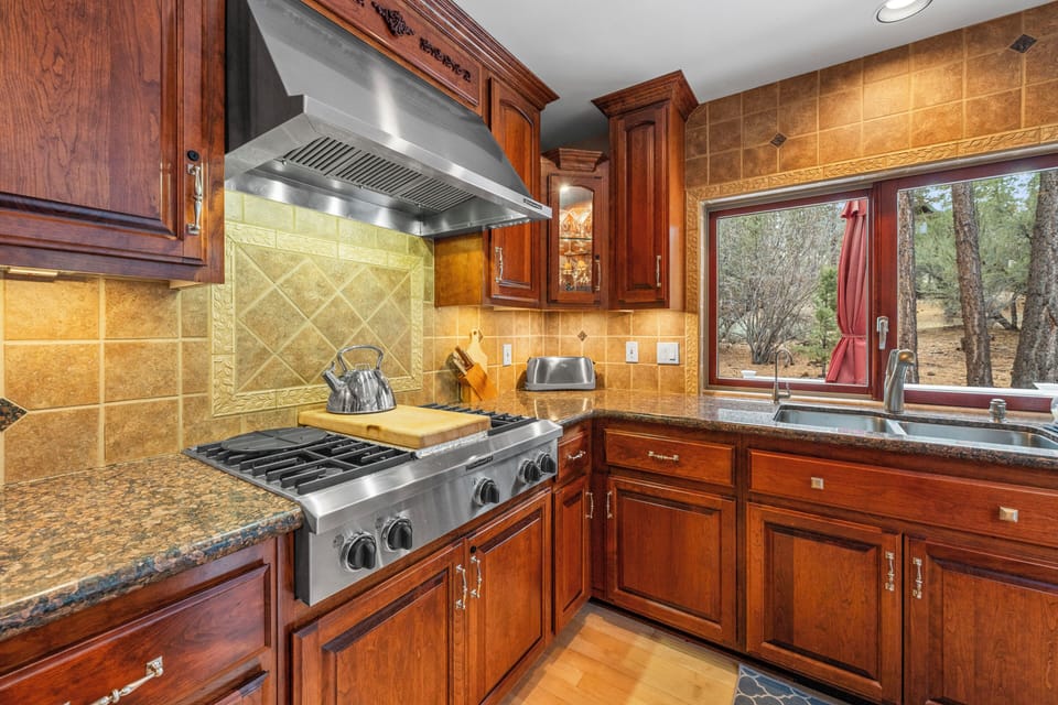Full Kitchen - Cook with ease in a fully equipped gourmet kitchen featuring high-end appliances and a curated coffee and tea station. Ample counter space and quality cookware make preparing delicious home-cooked meals effortlessly enjoyable.