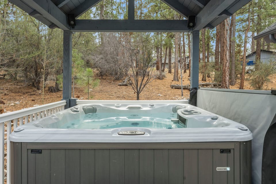 Back Deck - Private Deck with Private Hot Tub, gazebo, Propane BBQ, and table with chairs.
