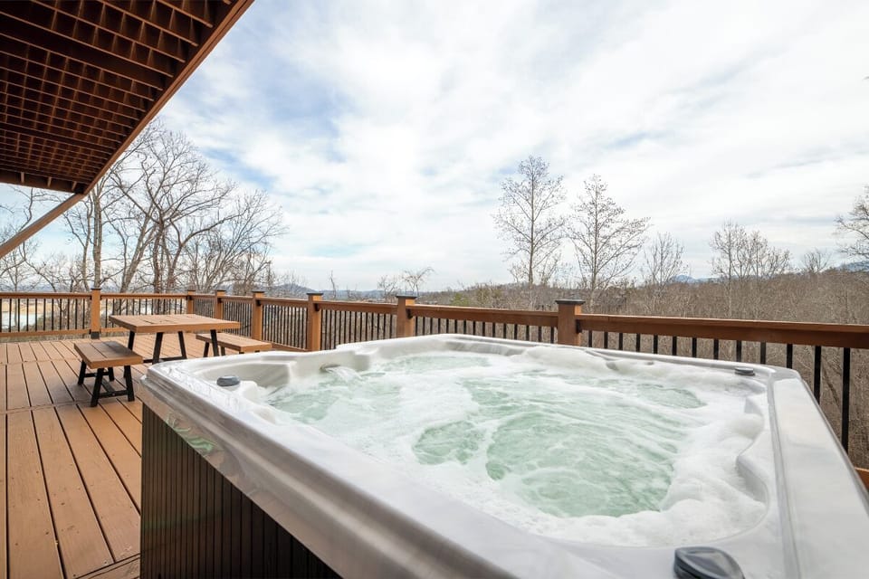 Soak in your private hot tub while taking in sweeping mountain views from this spacious deck.