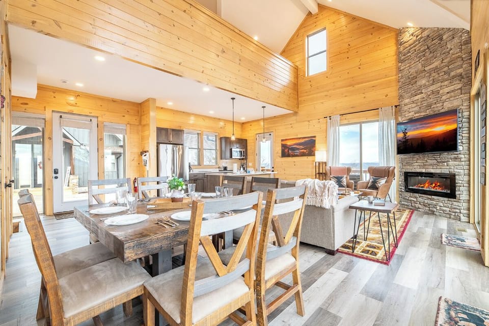 Unwind in your spacious retreat featuring warm wood accents, stone fireplace, and open-concept design perfect for memorable gatherings.