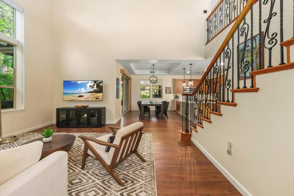 Unwind in your spacious living area with gleaming hardwood floors, comfortable seating, and an open flow to the kitchen—perfect for relaxing evenings.