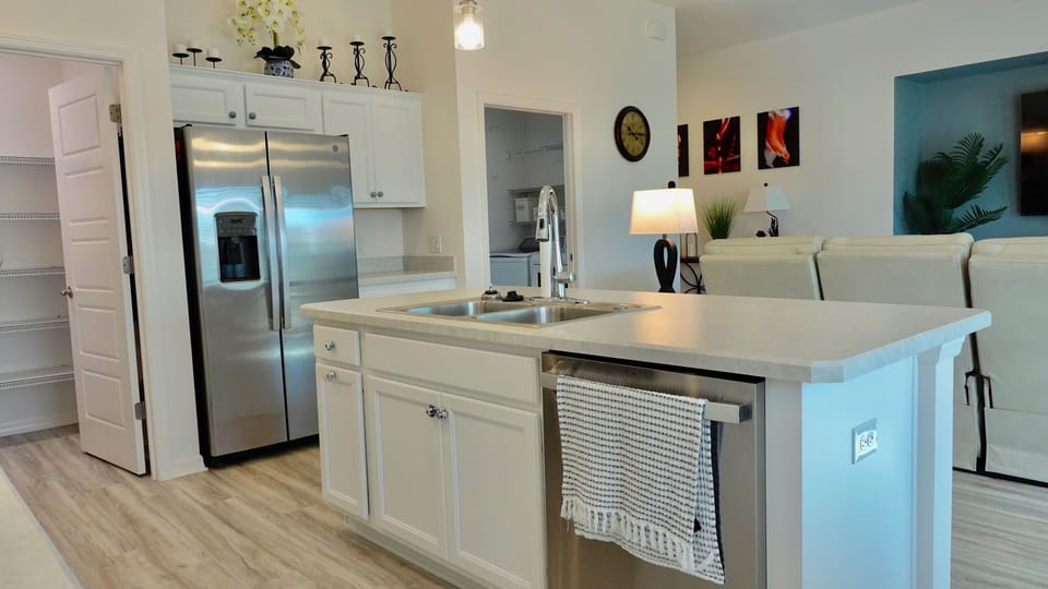 Your modern kitchen awaits with stainless steel appliances, spacious granite counters, and an island perfect for morning coffee or meal prep.