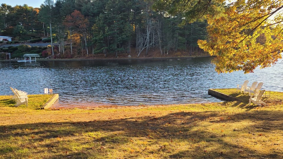 Our private beach with several Adirondack chairs