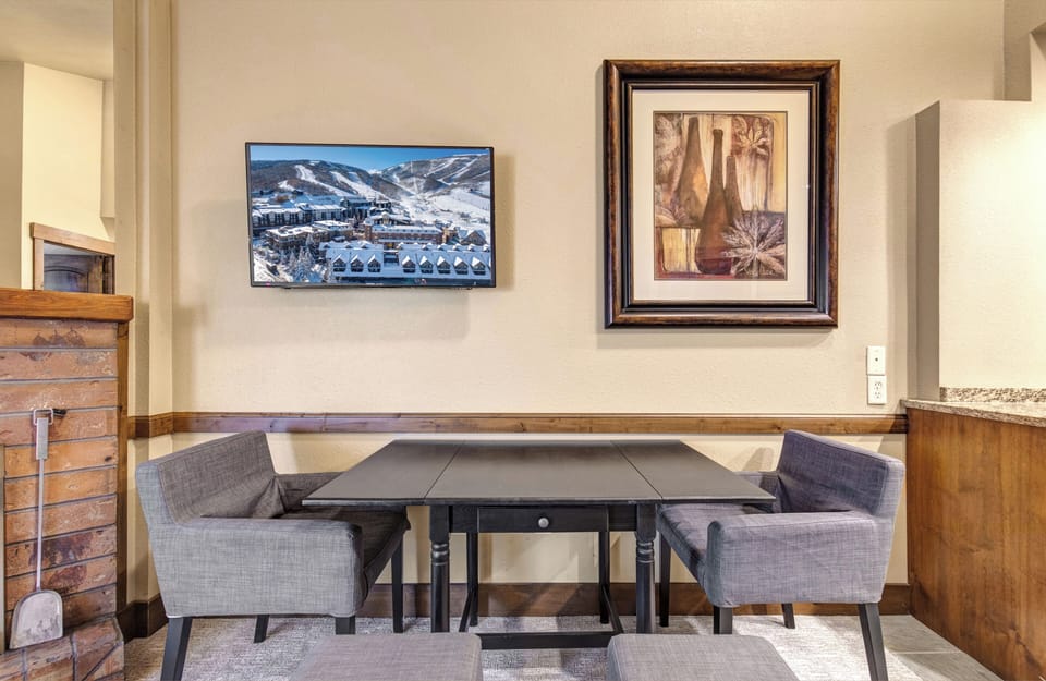 Your cozy dining nook features a stylish expandable table and comfortable seating.