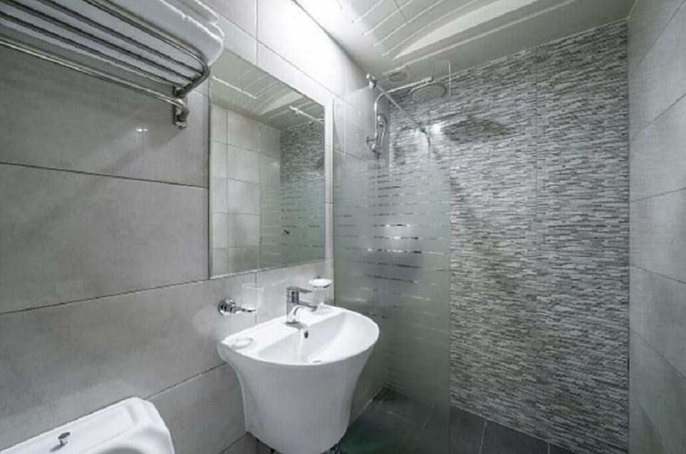 Standard Double Room | Bathroom | Hair dryer, slippers, towels, soap