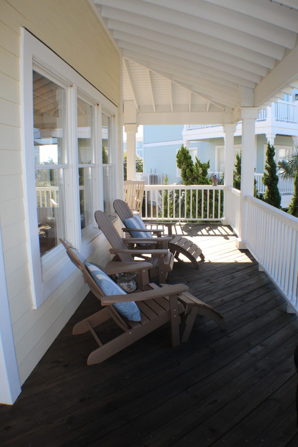Covered deck overlooks the pool and is great any time to relax, day or night.