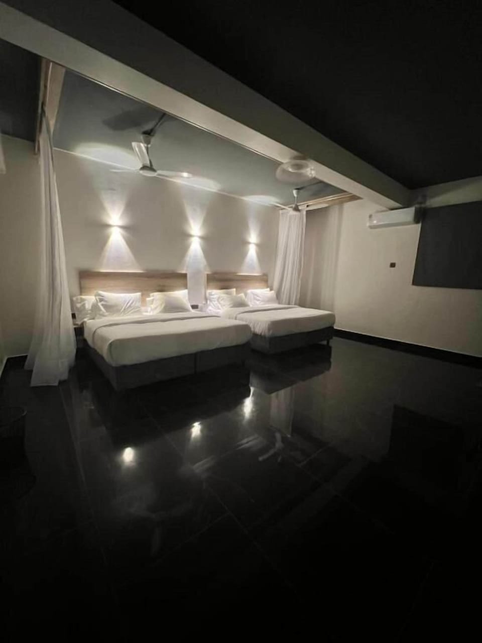 Deluxe Quadruple Room, City View | In-room safe, desk, laptop workspace, iron/ironing board