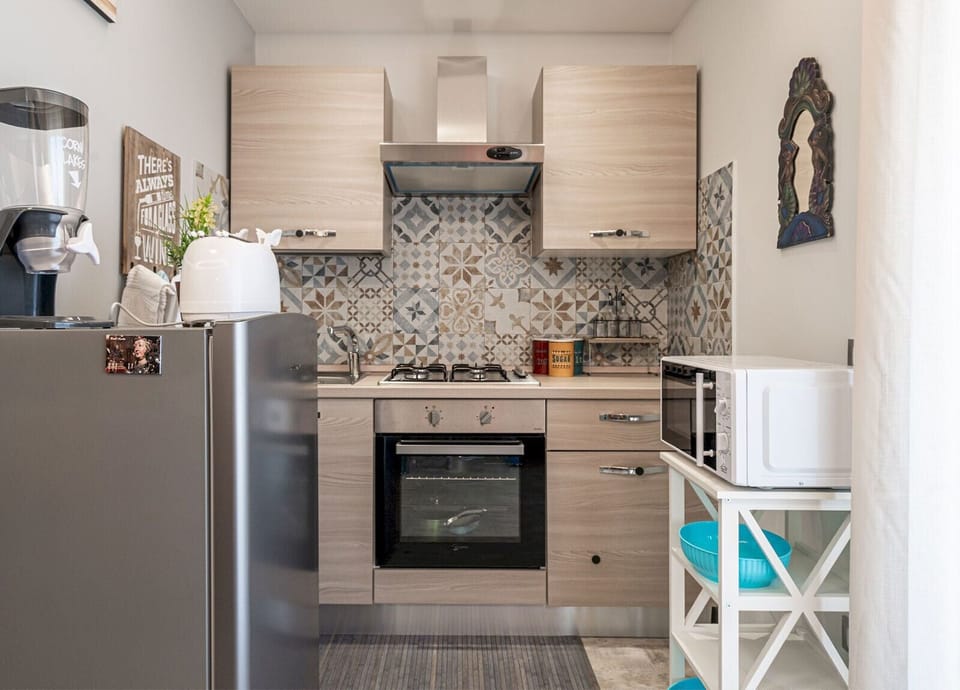Signature Apartment, Balcony, City View | Private kitchen | Espresso maker, electric kettle