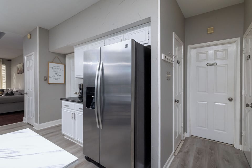 Modern kitchen featuring a large stainless steel fridge
