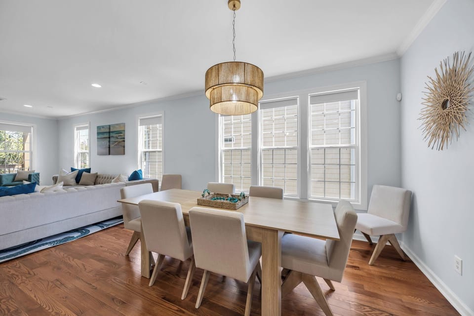 Bright dining room with elegant chandelier and cozy seating