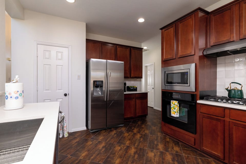 Functional kitchen space with an undermount sink and bar seating.

