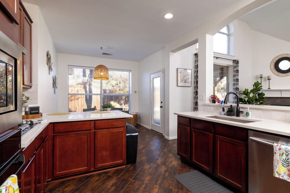 Sleek kitchen with premium stainless steel appliances.
