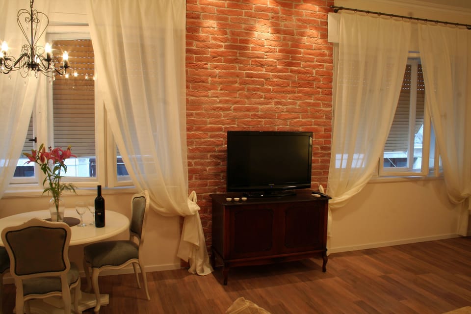 Superior Studio | Living area | 36-inch LCD TV with cable channels, TV