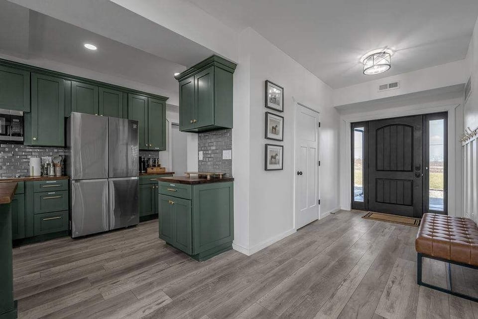 A bright and welcoming entryway with easy access to the spacious kitchen and living areas.