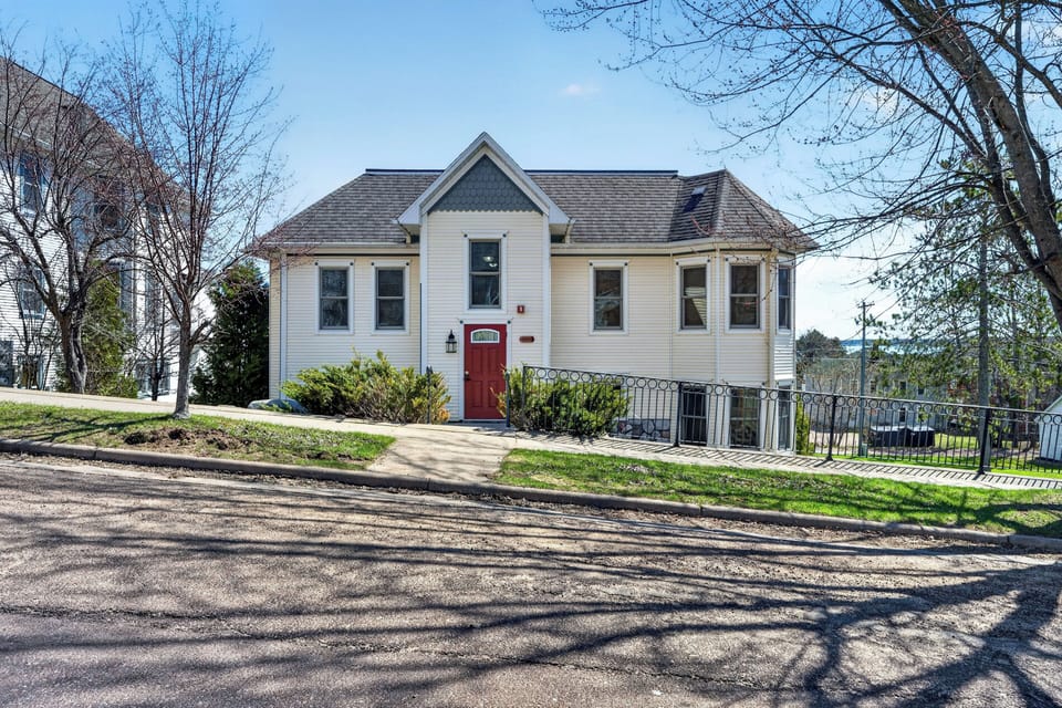 Front door to condo with street parking