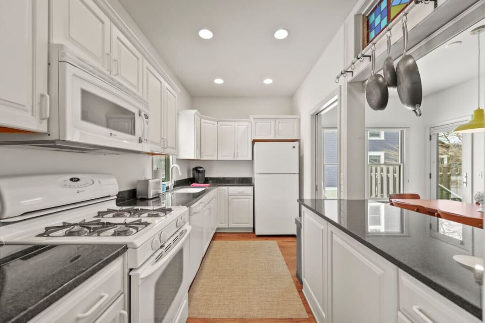 Fully equipped, sun-filled kitchen with everything you need to cook meals comfortably during your stay.